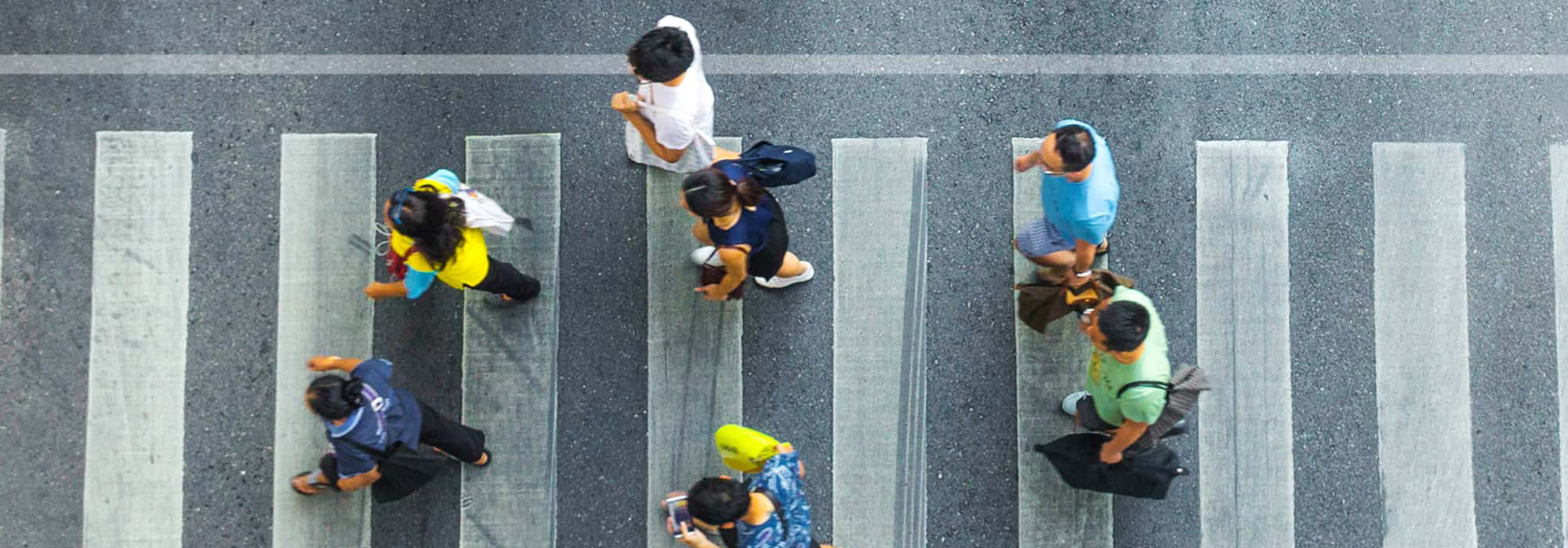 busy city crowd move to pedestrian crosswalk on businees traffric road