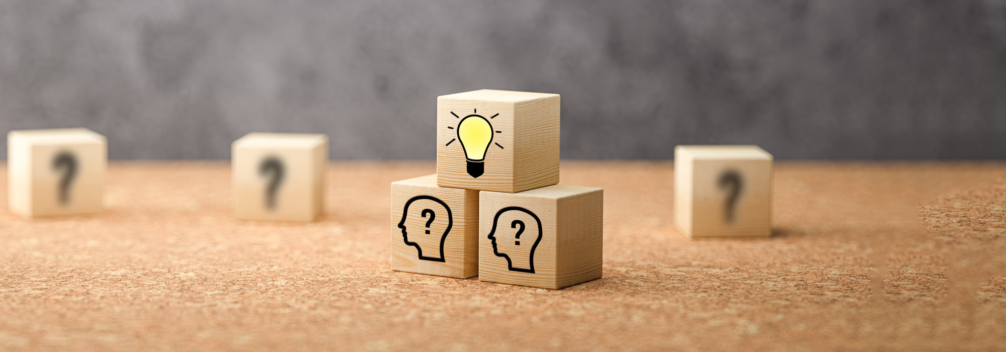cubes showing a brainstorming session on concrete background