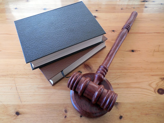 brown gavel next to books