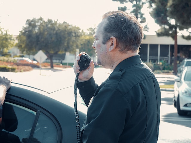 officer standing outside of car