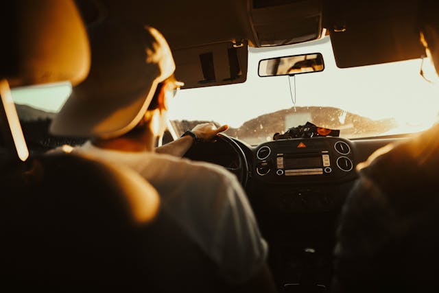 man driving a car