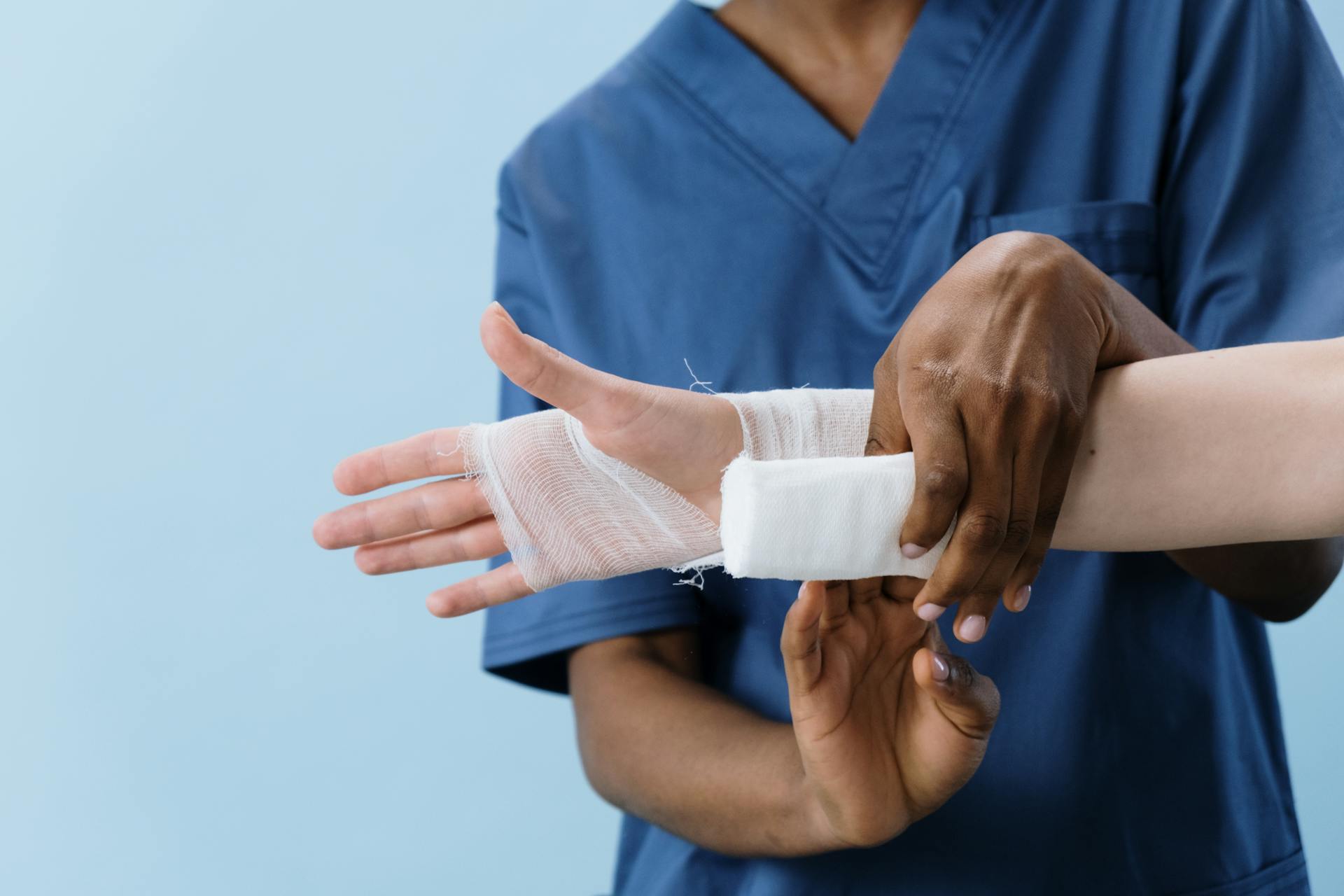 person having hand wrapped