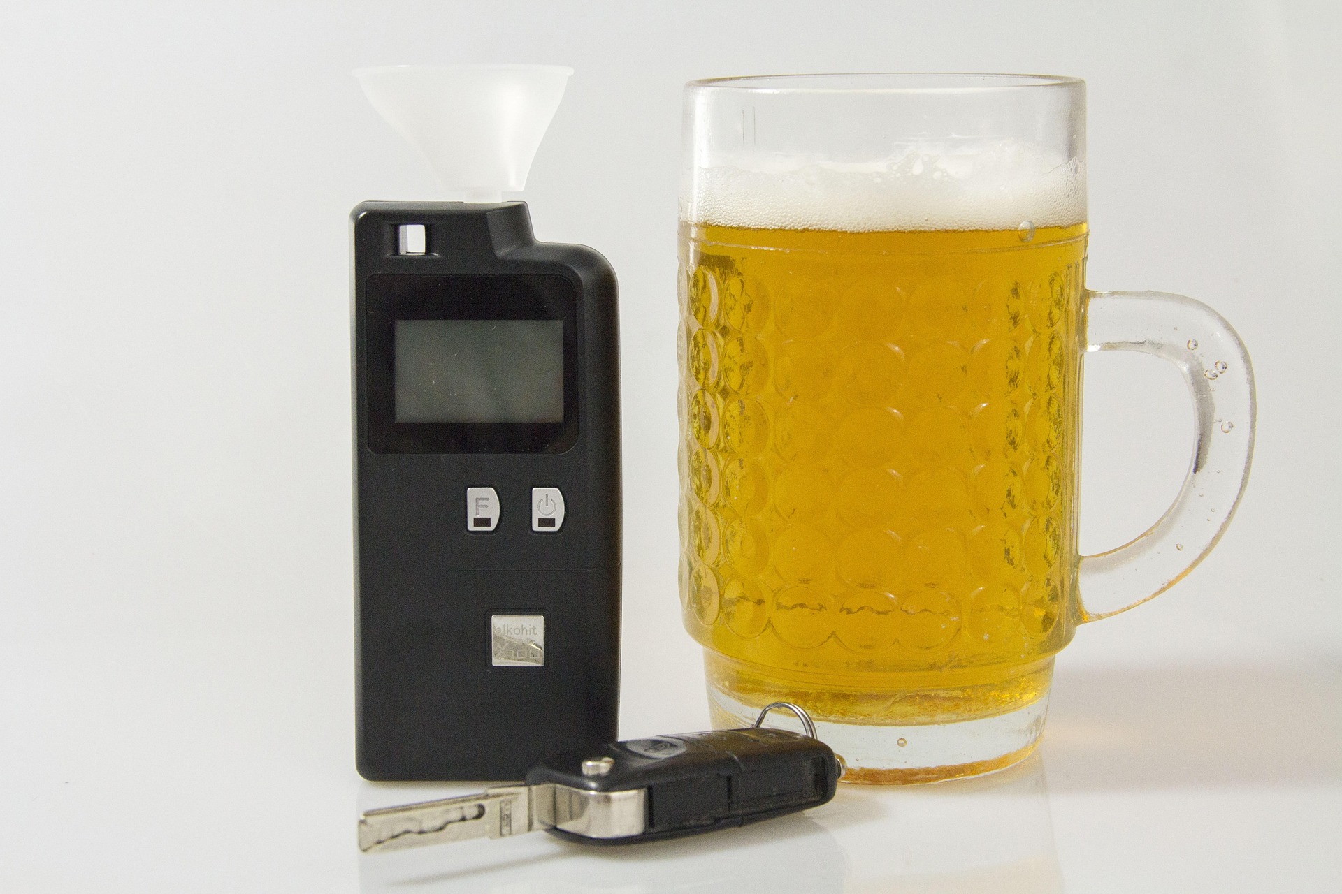 beer, car key, and breathalyzer